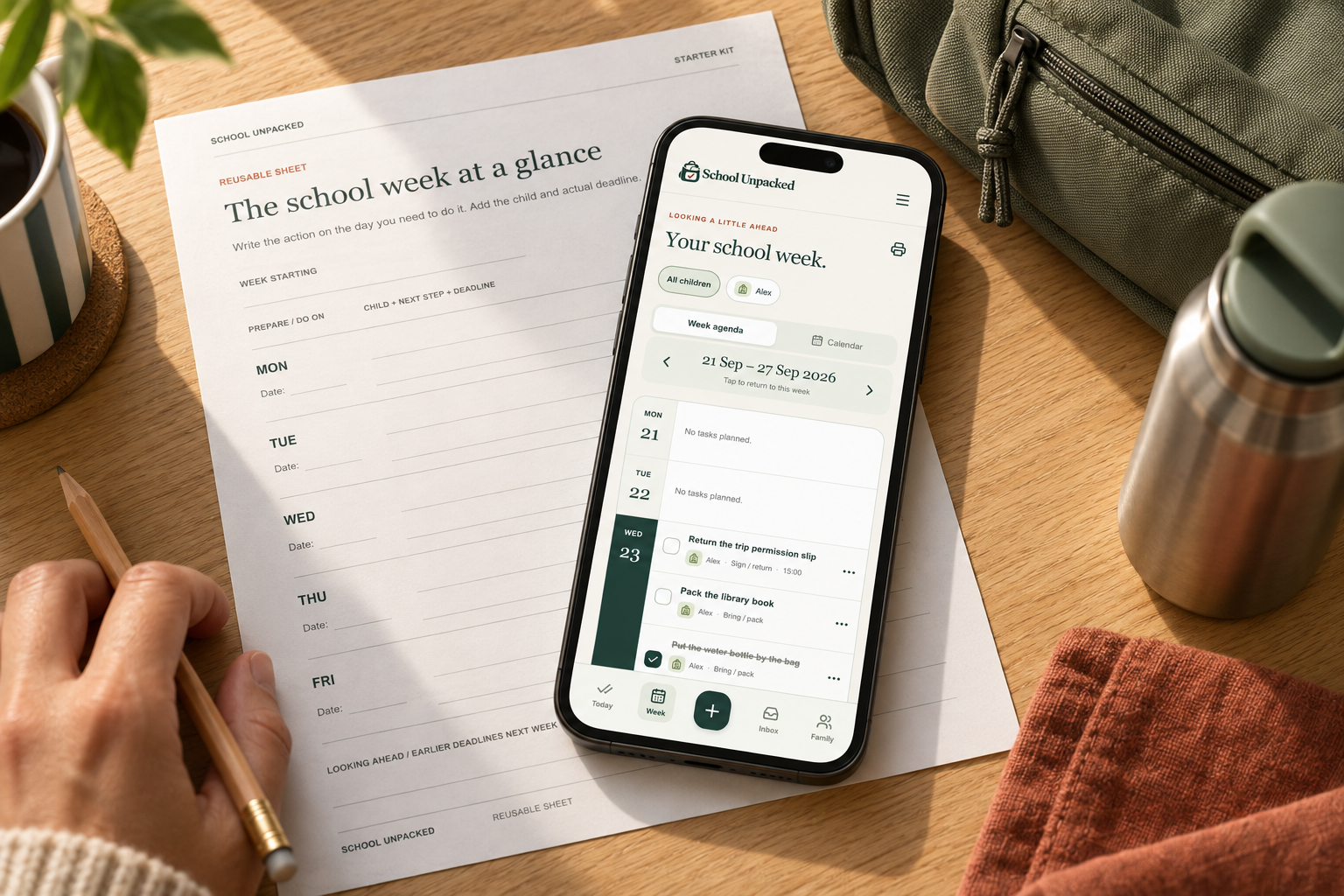 A school notice beside a phone displaying School Unpacked